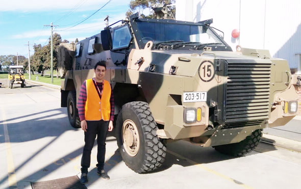 Michael Saleh with Bushmaster vehicle